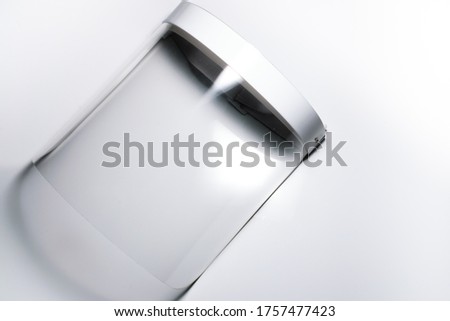 An isolated face shield for protection against COVID 19 in a white background Royalty-Free Stock Photo #1757477423