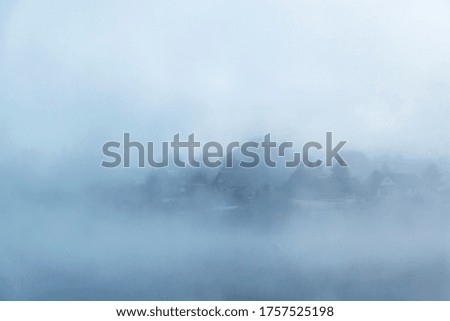 River before sunrise in the fog in the countryside