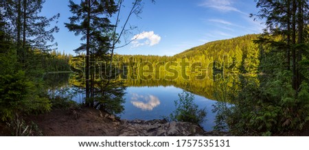 Chadsey Lake, Fraser Valley, Abbotsford, British Columbia, Canada. Located East of Vancouver. Beautiful Panoramic Canadian Landscape View during Sunny Day. Nature Panorama Background. Royalty-Free Stock Photo #1757535131