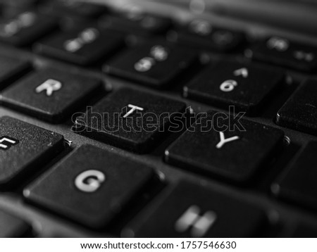 keyboard white / gray / black laptop. Laptop keyboard. Laptops are mobile. Black keyboard on a gray laptop. keyboard close up with black keys. soft focus. blurred image
