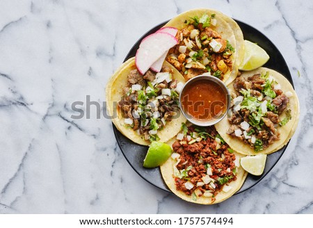 plate of mexican street tacos in copy space composition