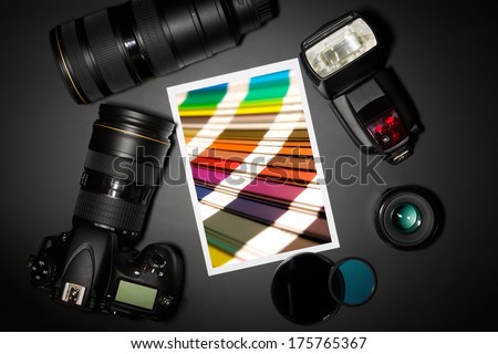 camera and lense on black showing photographer still life 