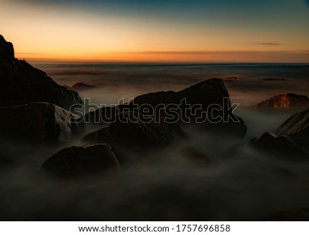 A calm sunrise along the coast of Otter Cliffs, Acadia National Park, Maine. 