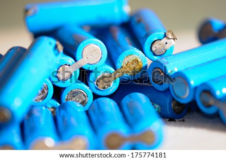 Recycle process with some old AA batteries Royalty-Free Stock Photo #175774181