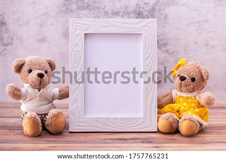 couple teddy bear with Picture frame on table wooden. Valentine's Day celebration