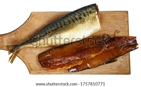 Picture of smoked headless fillet of mackerel on kitchen wooden board