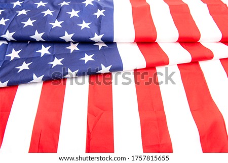 Natural fabric crumpled USA flag, rag American flag top view as texture or background, high resolution picture