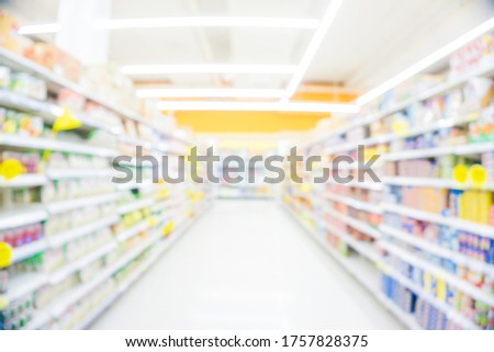 Blurred food and drink on shelf in super market with cart colorful product Royalty-Free Stock Photo #1757828375