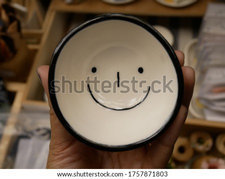 Smiling coffee on a bright day.