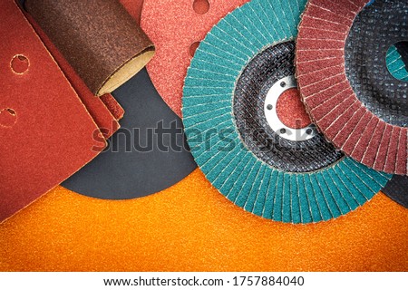 Set of abrasive tools and sandpaper used for cleaning or grinding products Royalty-Free Stock Photo #1757884040