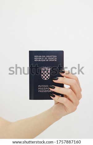 Croatian passport in girl's hand