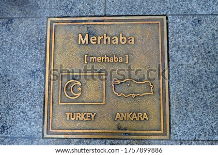 Greeting in Turkish with a map of the country and a flag.