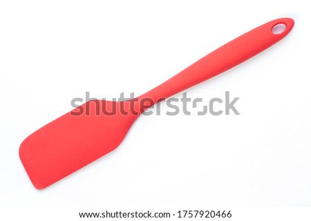 Red silicone spatula with copy space on the left. Royalty-Free Stock Photo #1757920466