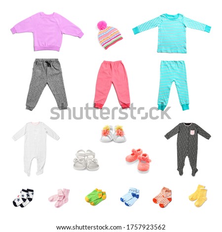 Set with different baby clothes on white background 