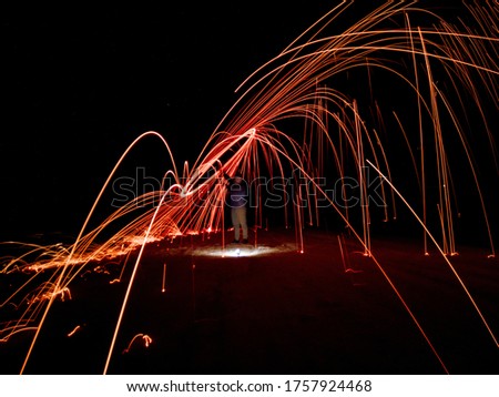 photography performed with long exposure, using steel wool for the effect of sparks