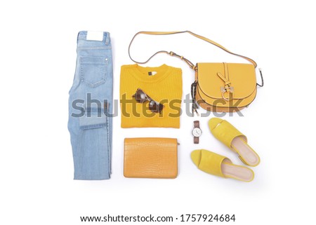 flat lay of woman yellow jeans jacket and accessories, Trendy fashion female background