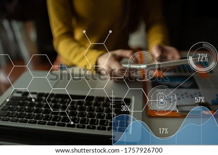 Female using touch tablet,holographic on internet technology background.- Workplace concept Image
