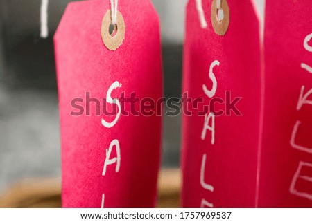 A selective focus shot of red sale tags