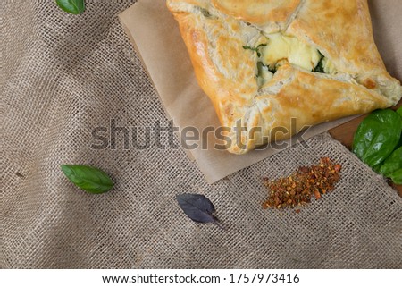 Caucasian pastries with meat on a linen background