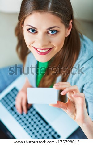 Woman, laptop. credit card. Shopping on couch. Female model.
