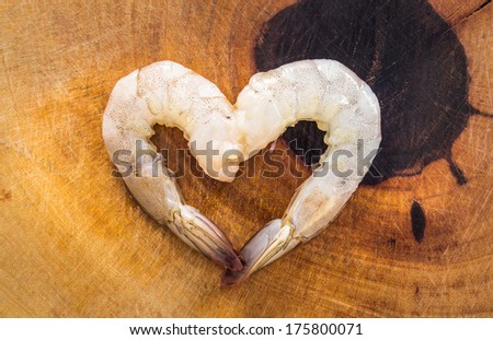 Fresh shrimp on the wood background