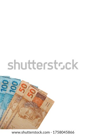 Brazilian Real banknotes isolated on white background. Brazilian money. Vertical photo.