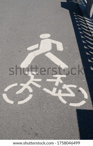 
cyclist and pedestrian road sign in the city