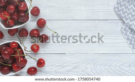 Flat lay view of fresh fruit sweet ripe cherries in bowl with water droplets. Fresh antioxidants diet summer fruits