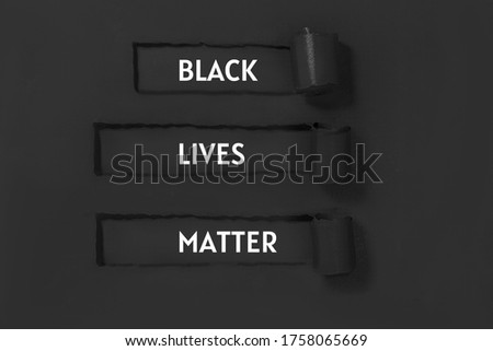 Words on black craft paper. Stop racism layout. Sign that says, Black lives matter.