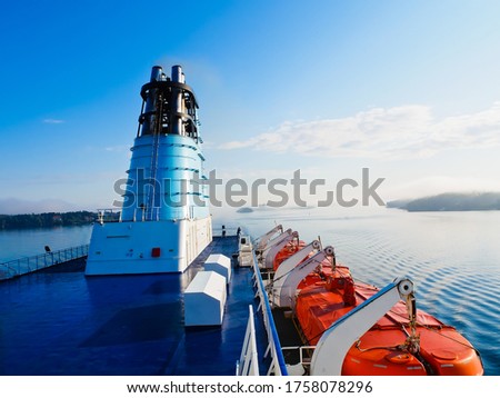 scenic view of Cruise ship with the background of cloud on the ocean and island in Stockholm archipelago in a misty morning Stockholm sweden