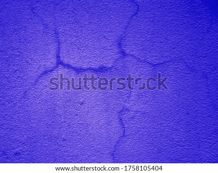 blue wall texture with cracks. uneven navy background