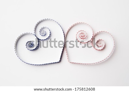 Quilling paper on white cardboard. Background with hearts for Valentine's day.