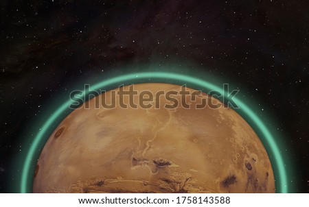Planet of Mars with green glow in the atmosphere of Mars - "Elements of this Image Furnished By Nasa "