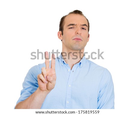 Closeup portrait of funny looking guy, skeptical, suspicious, skeptical, sarcastic business man showing number two, victory, reassurance sign, isolated on white background. Human  face expressions