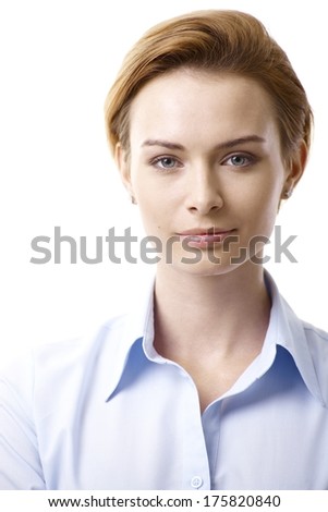 Closeup portrait of young woman with pure face, looking at camera.