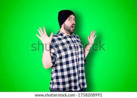 Man over isolated chroma background studio with surprise facial expression