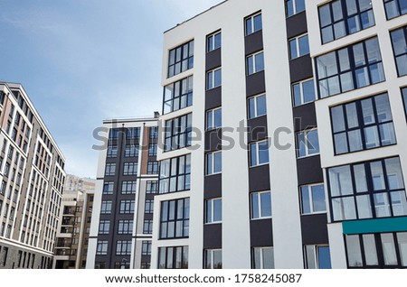 Modern European residential apartment buildings quarter on a sunny day with a blue sky.Abstract architecture, fragment of modern urban geometry