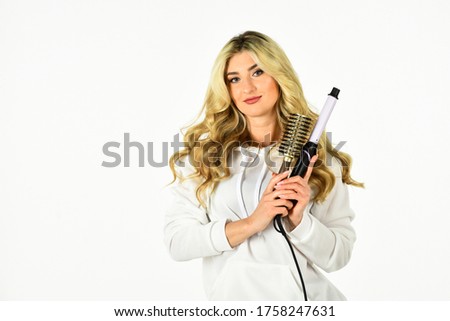 Hairdresser tips. Girl adorable blonde. Buy tools. Online shop. Useful Curling Iron Tricks Everyone Should Know. Create hairstyle with curling iron. Woman with long curly hair use curling iron.