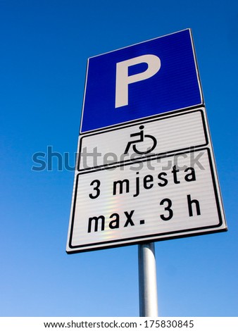 handicapped parking sign (29) and blue sky