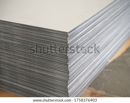 Many steel sheets in stock Royalty-Free Stock Photo #1758376403