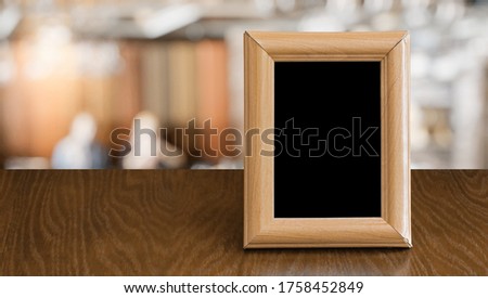 old photo frame on the wooden table in a night club