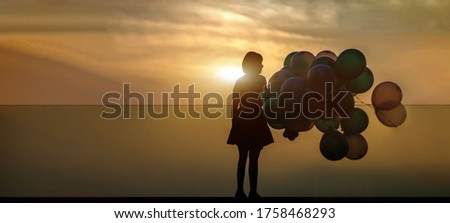 silhouette woman with ballooon on high building in twilight sunset on banner background