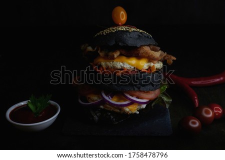 delicious burger with peppers on the front background