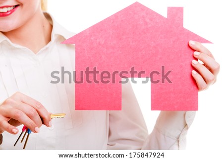 Woman real estate agent holding red paper house and keys. Property business and accommodation or home buying ownership concept, isolated on white background