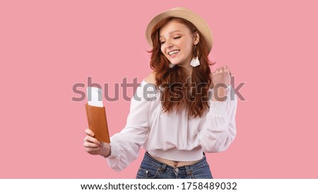 Smiling Traveler Girl Posing With Flight Tickets Gesturing Yes Over Pink Background. Vacation Concept. Panorama, Studio Shot