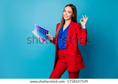 Renovation is done! Photo of attractive lady interior designer hold paint palette cards hands showing okey symbol wear luxury red suit blouse shirt isolated blue color background