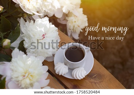 good morning. have a nice day. beautiful white peonies, a cup of coffee, meringues. romantic breakfast.
