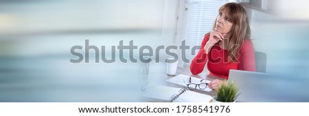 Portrait of thoughtful mature businesswoman looking up; panoramic banner