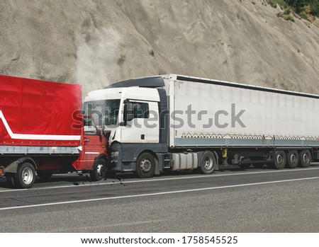 Trucks accident. Road accident. Two trucks collided head-on.  Royalty-Free Stock Photo #1758545525