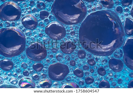 Beautiful abstract blue bubbles background pattern texture for design . Macro view. 